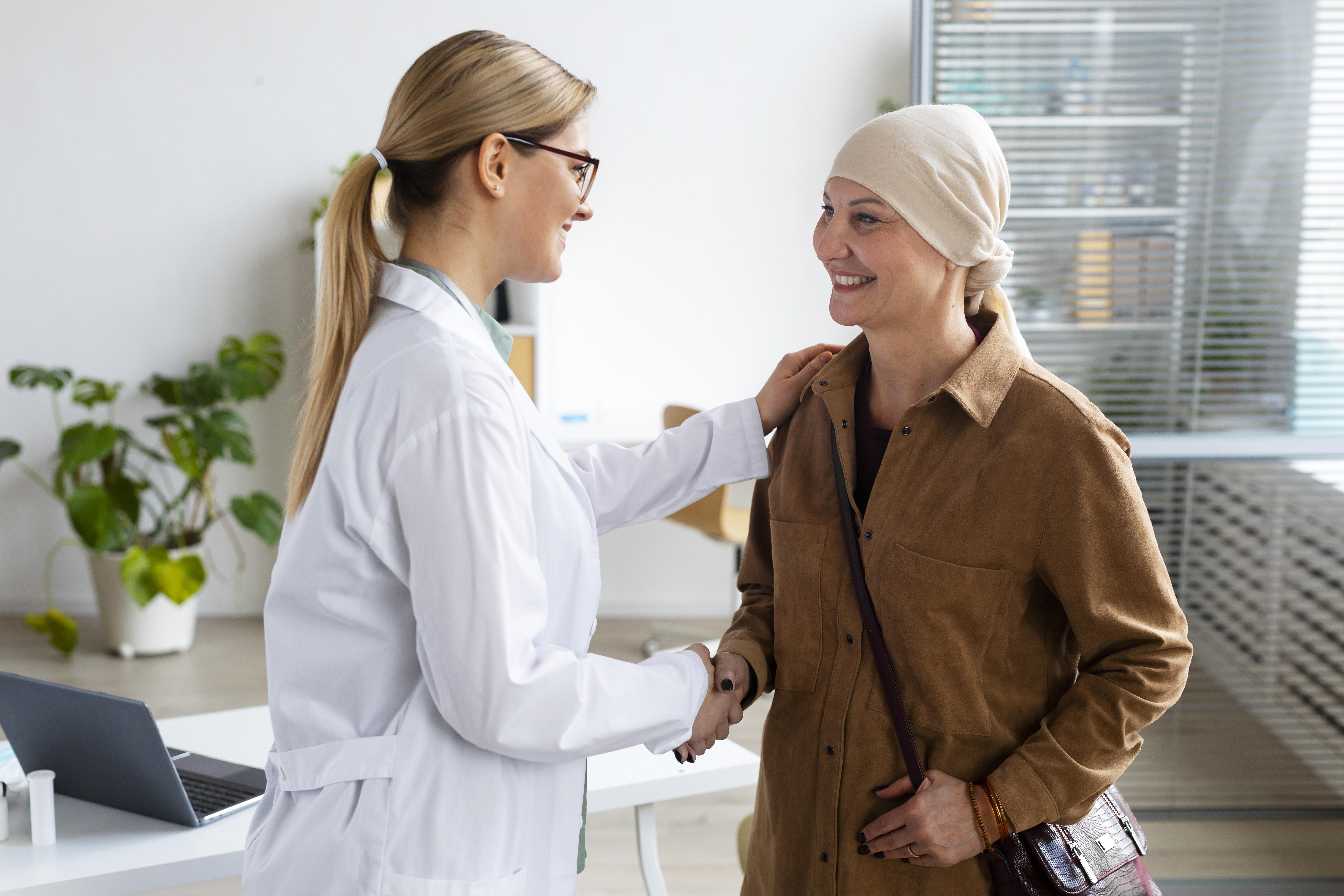 Doctor consulting with cancer patient
